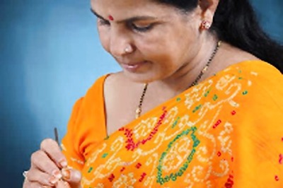 57-year-old woman artist writes slogans on rice grains to create poll awareness